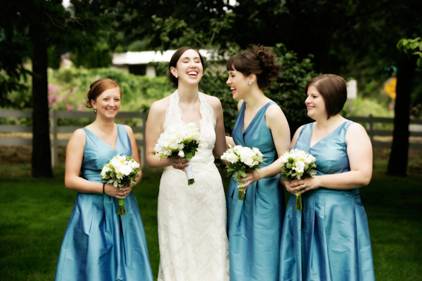 photo by Portland wedding photographers Altura Studio - laughing bride with her bridesmaids - light blue bridesmaids dresses 